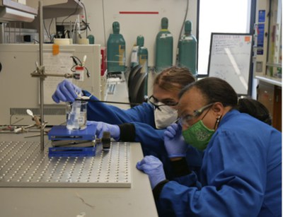 Photos for newsletterEWD 7.jpg Kristina Bradford, teacher at Eastview High School in Austin, TX and Joel Graves, her graduate mentor at UTA, conduct an experiment in Professor Joaquin Resasco’s lab.